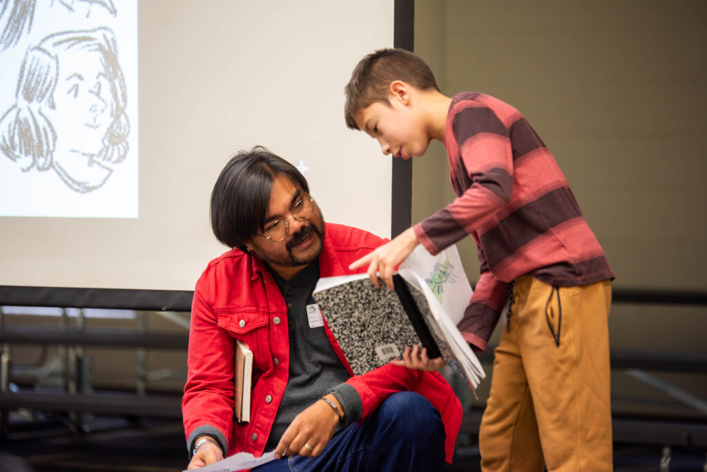 TPK8 student and book illustrator meet after presentation 