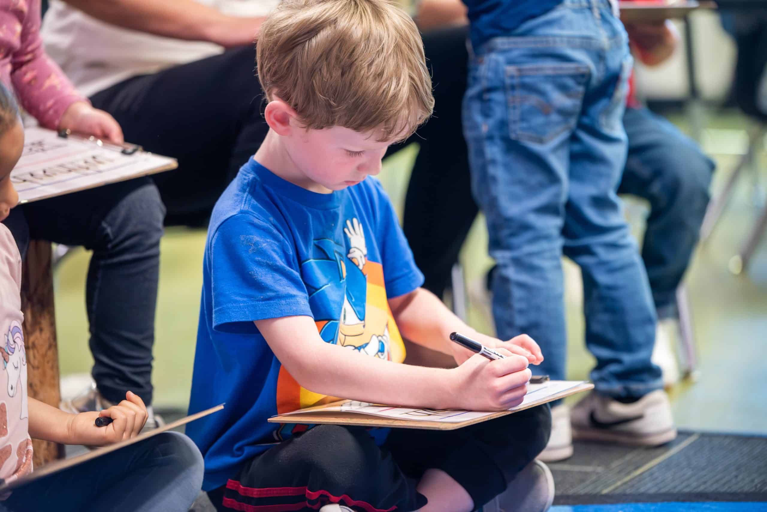 Timberline Preschool student practicing writing letters