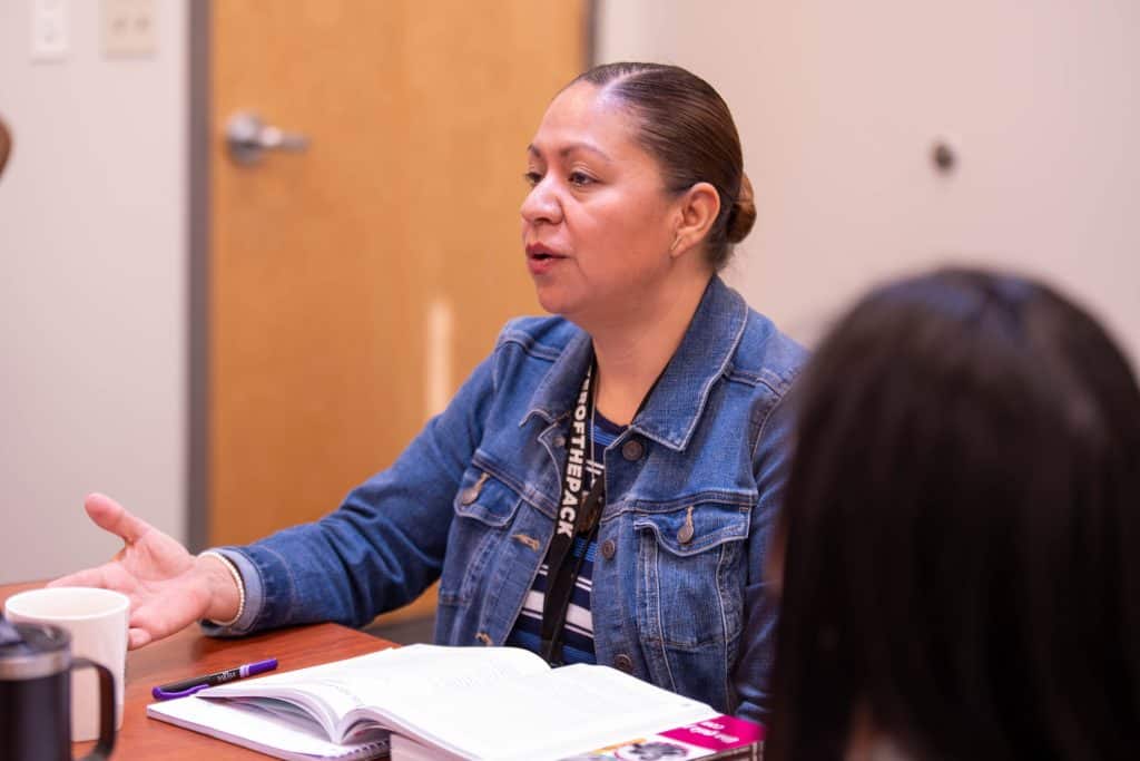 Timberline PK-8 Family Liaison, Maria Aldaba, leads a parent book club